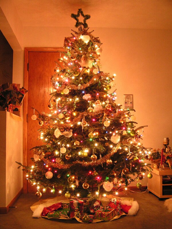 christmas tree with presents and lights. Electric christmas tree lights